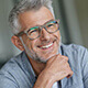 Closeup of a Man Smiling With Glasses